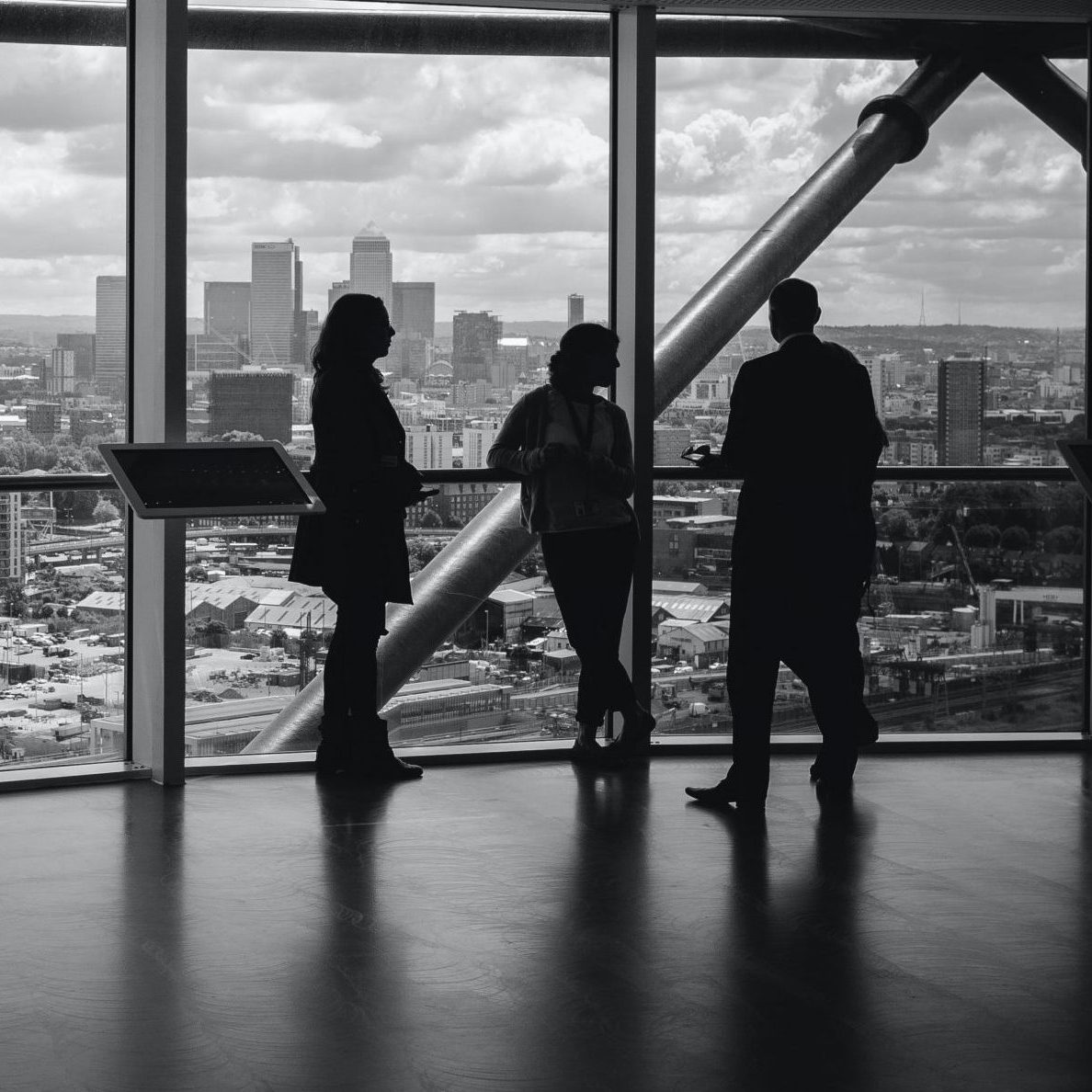 people standing inside city building